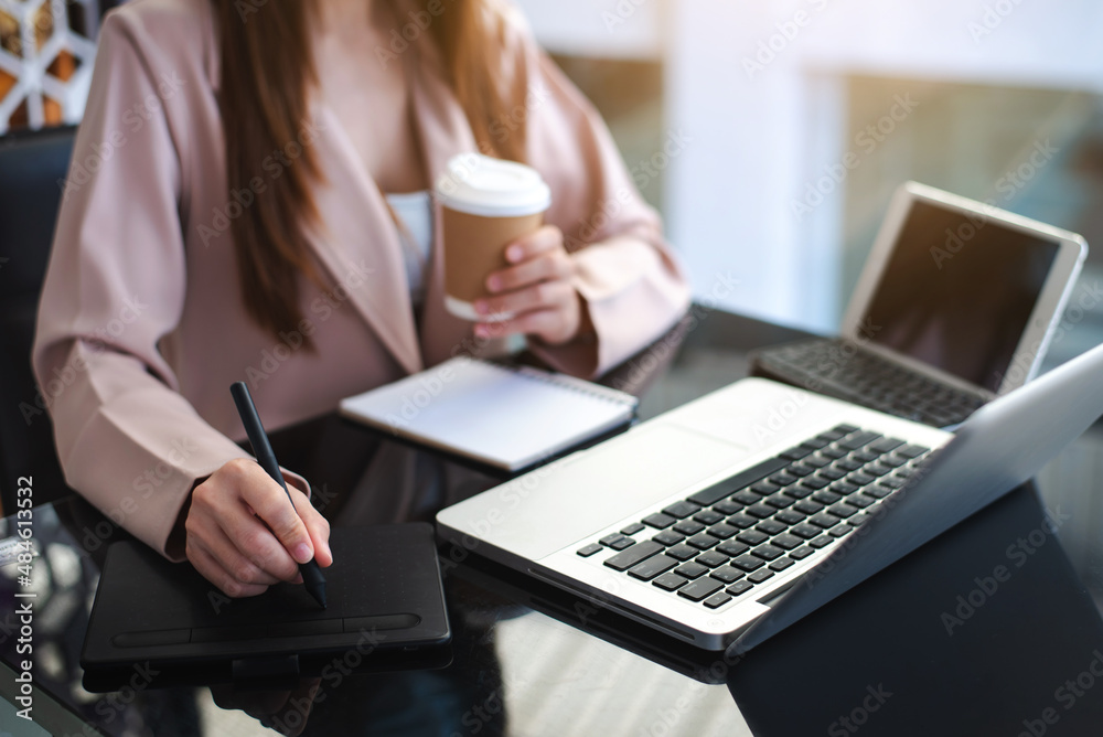 Working Process in Modern Office. Young Woman Account Manager Working at Wood Table with New Business Project. Typing keyboard,Using Contemporary Laptop. Working Process in Modern Office. Young Woman Account Manager Working at Wood Table with New Business Project. Typing keyboard,Using Contemporary Laptop.