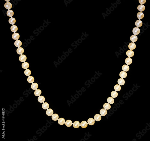 White pearls necklace on black
