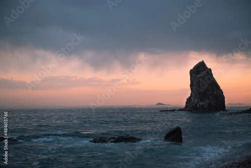 Scenic view on the beach. Seascape at the sunset. Dramatic stormy sky