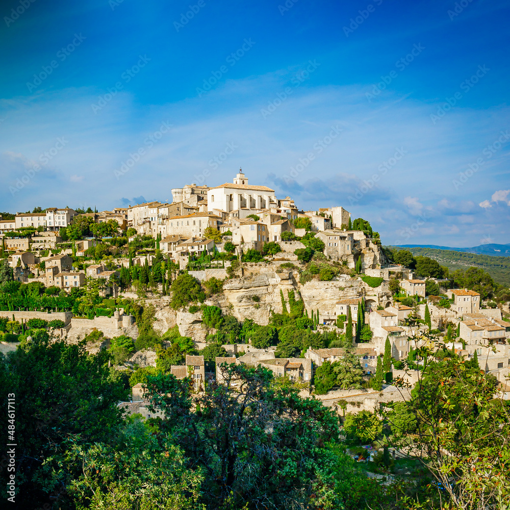 Village of Gordes in the Luberon valley in Provence, France, on a summer day with blue sky
