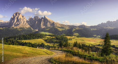 Alpe di Siusi or Seiser Alm, Sassolungo mountain and pathway, Dolomites Alps, Italy.