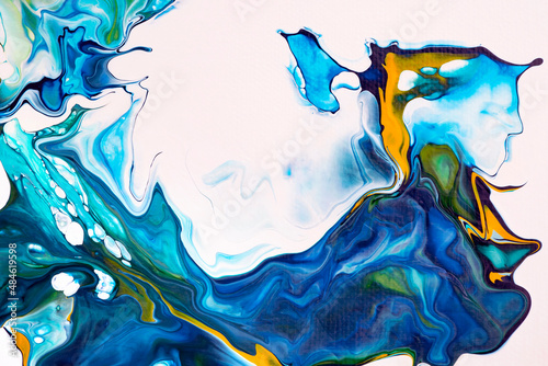 Bright spills of dark blue, light blue, turquoise, orange colors on a white background. Abstract colorful painting with liquid acrylic. Modern abstract painting. A fragment of a work of art. photo