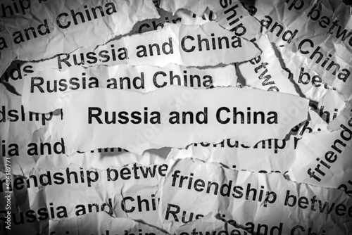 Newspaper strips with the words Russia and China printed on them. The concept of friendship between the two countries China and the Russian Federation
