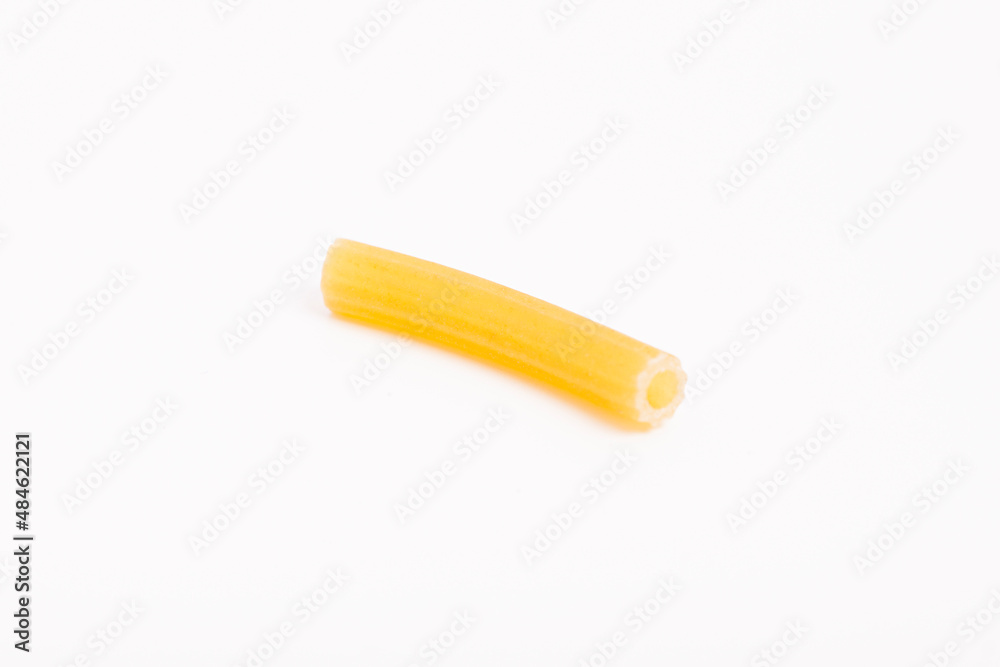 One piece of pasta on a white background.
One piece of pasta on a white background.