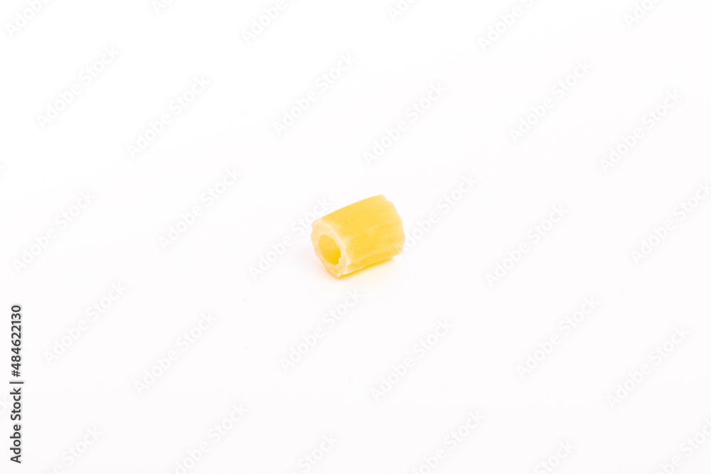 One piece of pasta on a white background.
One piece of pasta on a white background.