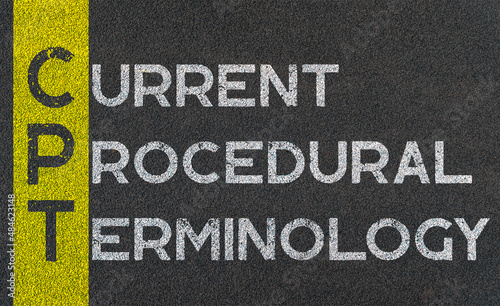 Current procedural terminology - CPT acronym written over road marking yellow paint line, business abbreviations. photo