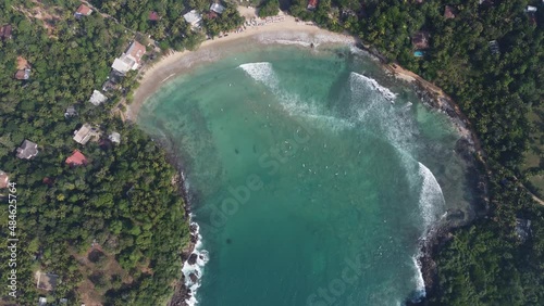 Aerial view of Hiriketiya Beach in Dikwella. Blue beach in Sri Lanka. Indian Ocean. High quality 4k footage