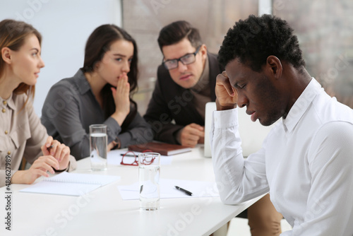 African American man suffering from racial discrimination at work