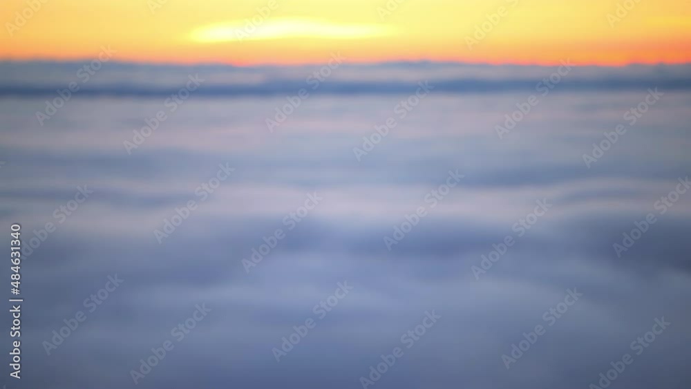 Mist fog covering mountain peaks rack focus shift from blurry in Wintergreen resort town in Blue Ridge mountains high angle aerial above view of inversion clouds at sunrise in Virginia Mist fog covering mountain peaks rack focus shift from blurry in Wintergreen resort town in Blue Ridge mountains high angle aerial above view of inversion clouds at sunrise in Virginia