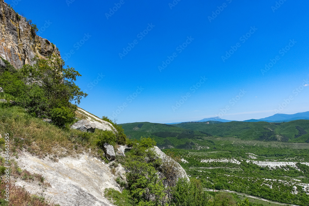 View of the picturesque Crimean mountains from the cave town of Tepe-Kermen in summer. May. 2021. Crimea. Russia.