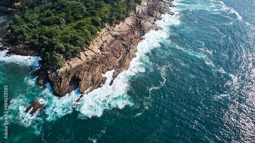 aerial view of the rocks against which the powerful waves of the Indian Ocean break. High quality photo