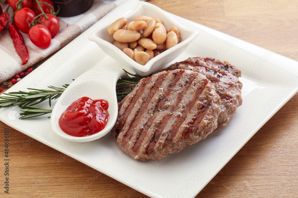 Grilled beef burger cutlet with sauce Grilled beef burger cutlet with sauce