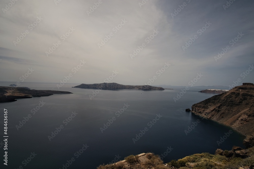 Panoramic view of the volcano Nea Kameni and the Aegean Sea in Santorini Greece Panoramic view of the volcano Nea Kameni and the Aegean Sea in Santorini Greece