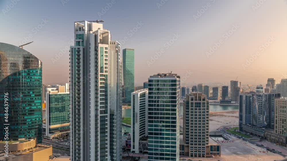 Business Bay Dubai skyscrapers with water canal aerial timelapse. Business Bay Dubai skyscrapers with water canal aerial timelapse.