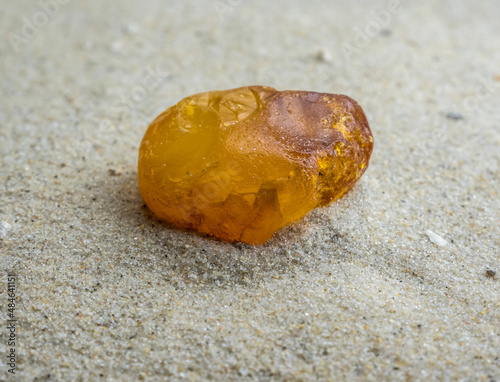 Bernstein liegt im Sand an der Nordsee photo