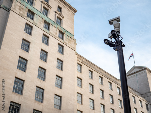 Security CCTV cameras watching over an anonymous Ministry of Defence government building in Whitehall, the heart of UK politics and governance.