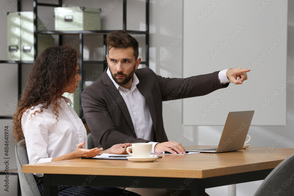 African American woman suffering from racial discrimination at work African American woman suffering from racial discrimination at work