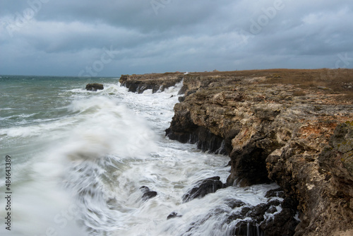 Dramatic seascape with rocks and waves - copy space