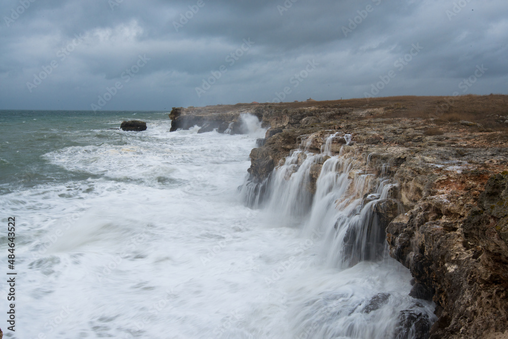 Dramatic seascape with rocks and waves - copy space Dramatic seascape with rocks and waves - copy space