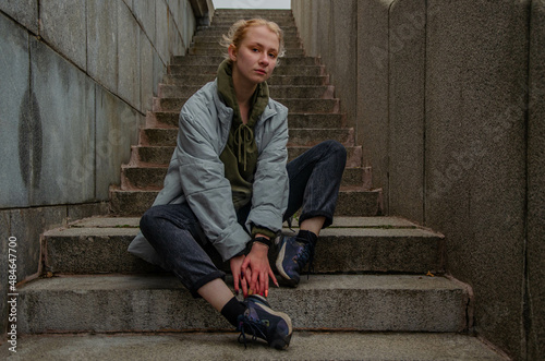 Woman posing on stone stairs