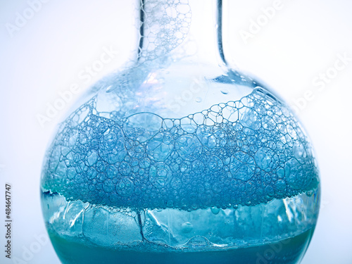 Glass flask with a chemical reagent. photo