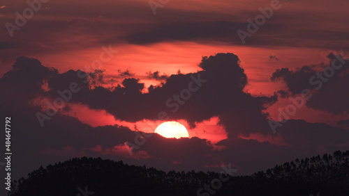 sunset between clouds in Guararema photo