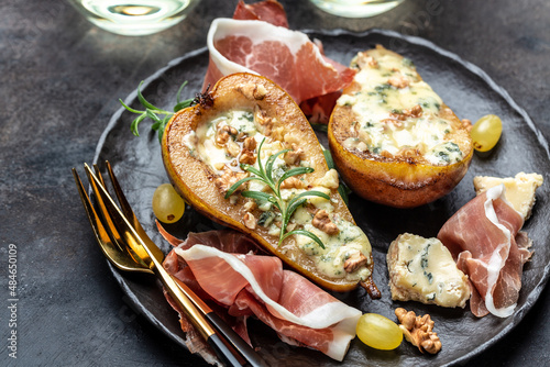 Canvas Print Appetizer with pear baked with blue cheese, nuts and honey, prosciutto