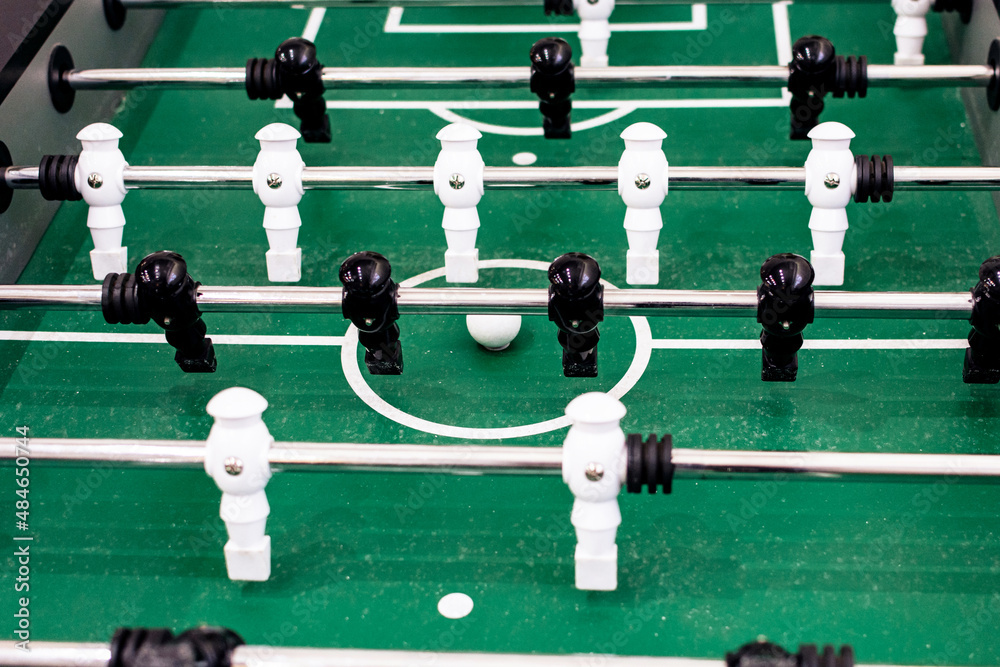 Table football with black and white figures close up Table football with black and white figures close up