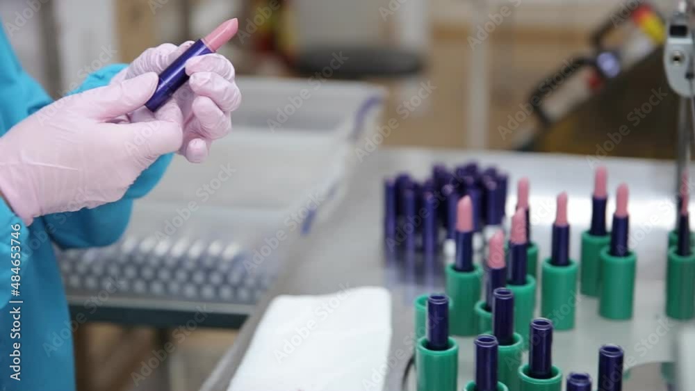 The process of cosmetic production. Quality check of lipstick. The process of cosmetic production. Quality check of lipstick.