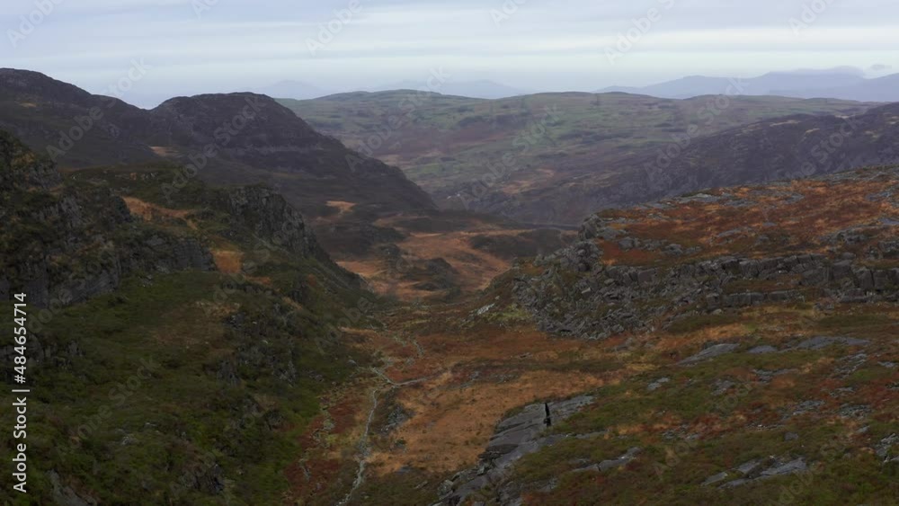 Rising aerial view of a mountain trail through a Welsh valley Rising aerial view of a mountain trail through a Welsh valley