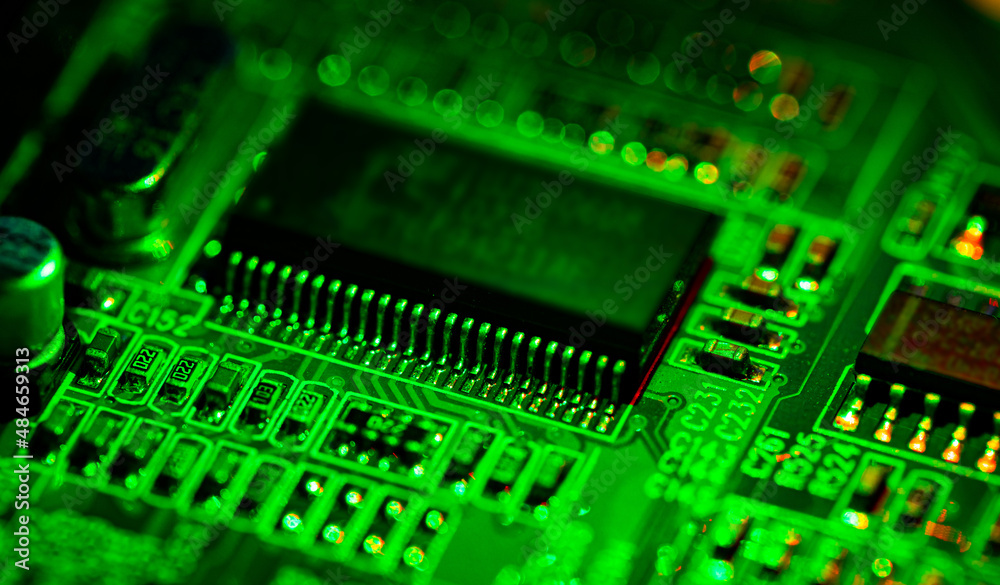 Close up of components and microchips on PC circuit board.. Close up of components and microchips on PC circuit board..