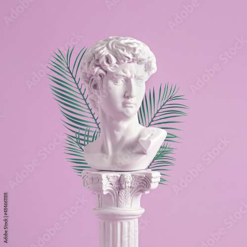 Antique style Roman or Grecian bust on a pedestal photo