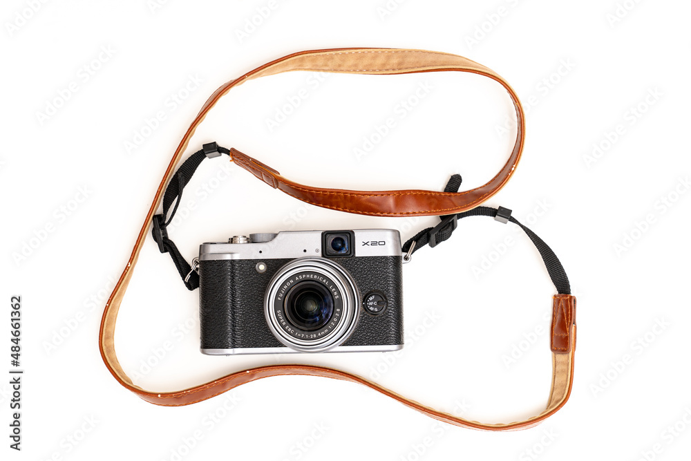 Fuji camera in retro style with a brown leather strap on a white  background. Stock-Foto | Adobe Stock