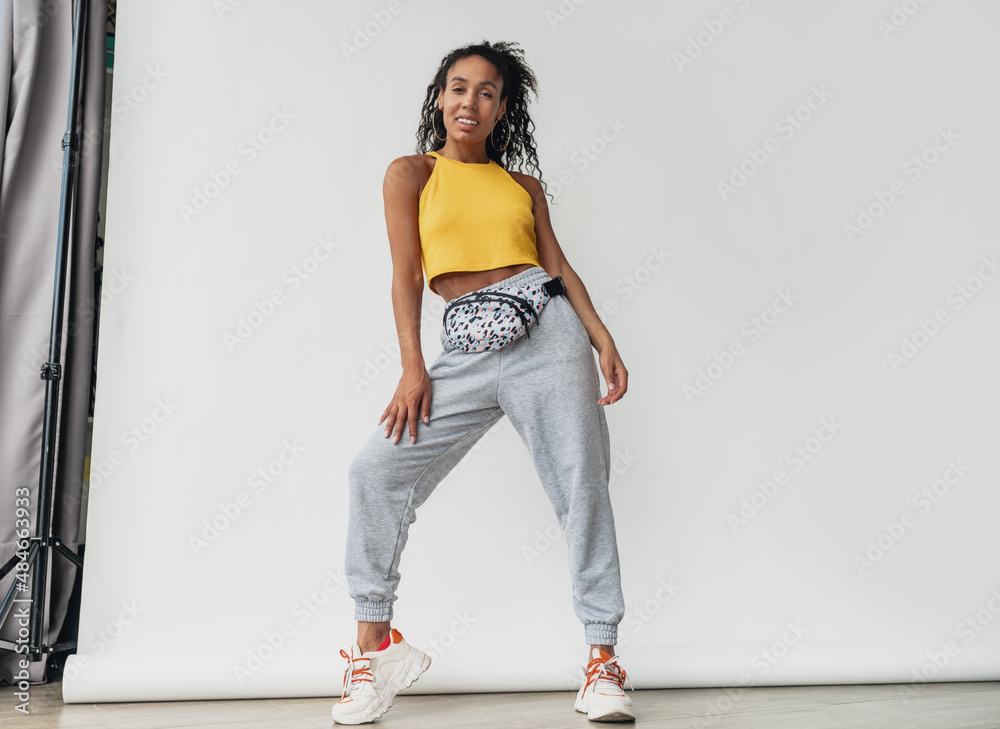 attractive black african american woman posing in stylish hipster