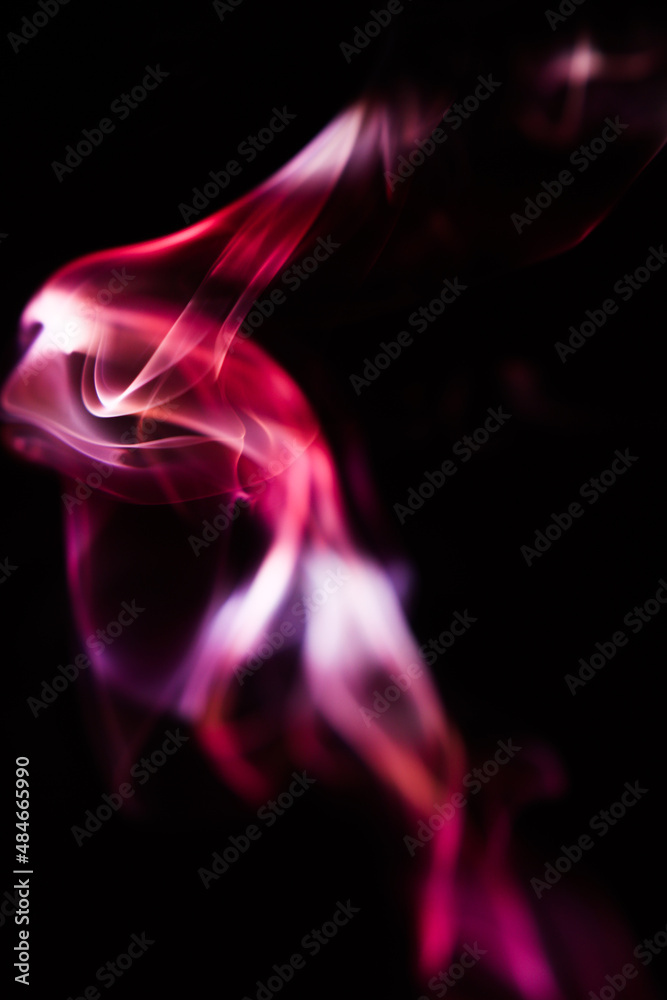 Pink and scarlet patterns of smoke from cigarettes and hookah, fumigation of a magical space