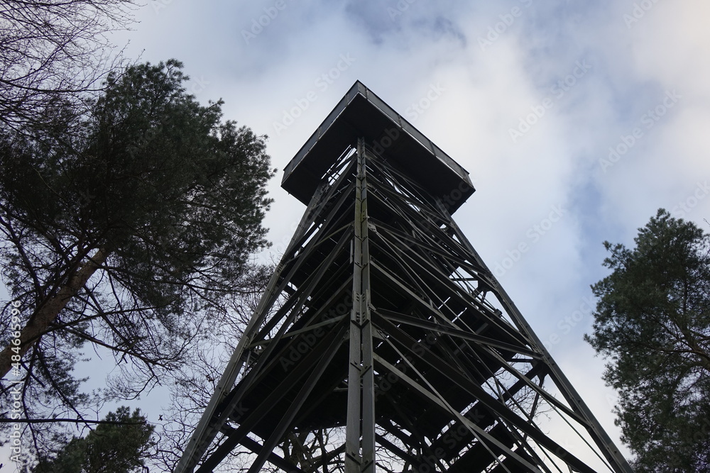 Obraz premium Looking up the steel framework of Friedrich Kabus Turm lookout tower under a dramatic and stormy winter sky, low angle view (horizontal), Bad Salzdetfurth, Lower Saxony, Germany