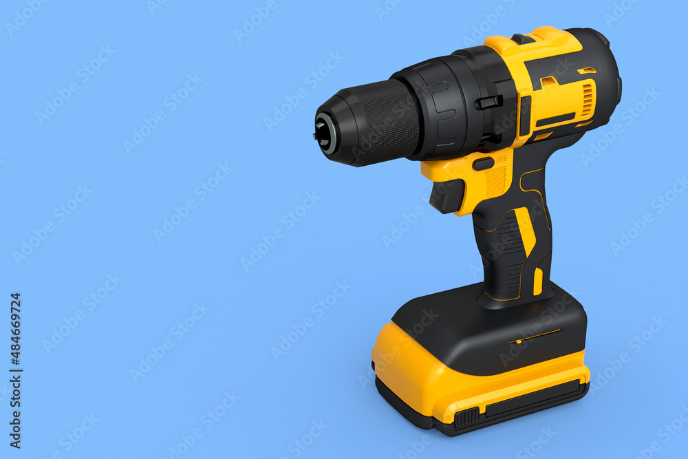 Cordless drill or yellow screwdriver isolated on blue background Cordless drill or yellow screwdriver isolated on blue background