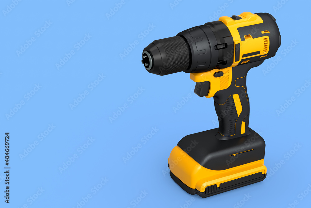 Cordless drill or yellow screwdriver isolated on blue background