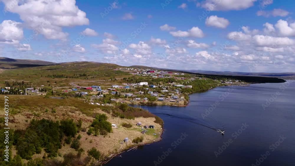 Aerial Scenic Shot Of Houses On Green Hills, Drone Flying Forward Over River - Saint Mary's, Alaska Aerial Scenic Shot Of Houses On Green Hills, Drone Flying Forward Over River - Saint Mary's, Alaska