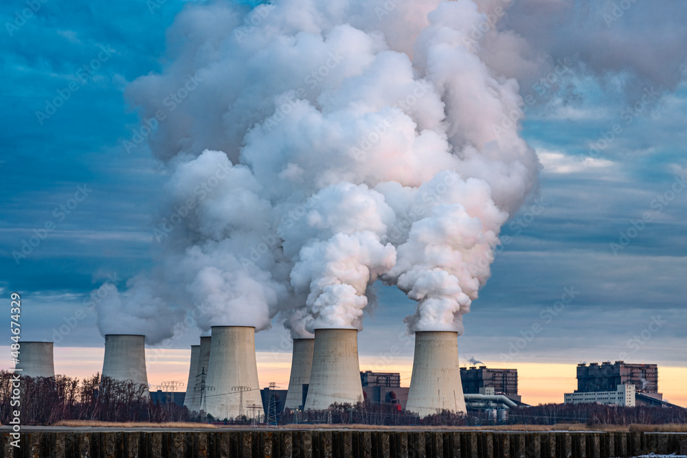 Smoking pipes of thermal power plant on sunset. Smoking pipes of thermal power plant on sunset.