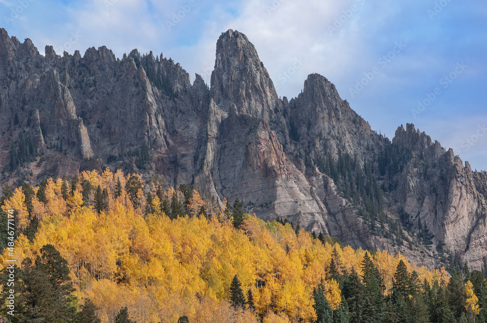 Landscape of autumn aspens and the Needles rock formation, San Juan Mountains, Colorado, USA