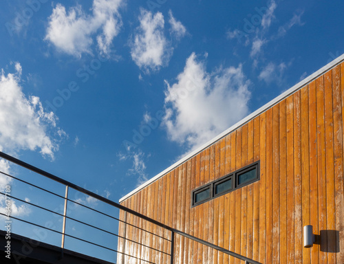 wooden building perspectively with white cloud and lighting sky