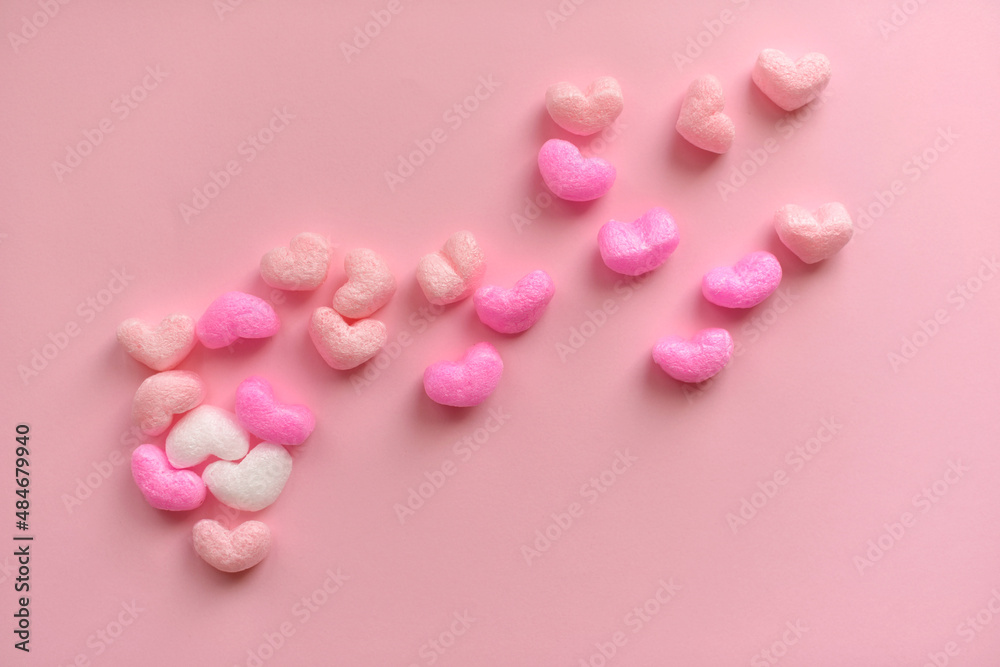 Valentine's Day concept with red hearts on pink background