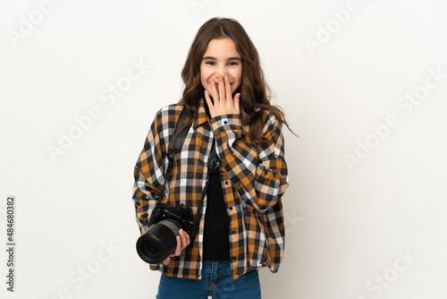Little photographer girl isolated on background happy and smiling covering mouth with hand © luismolinero