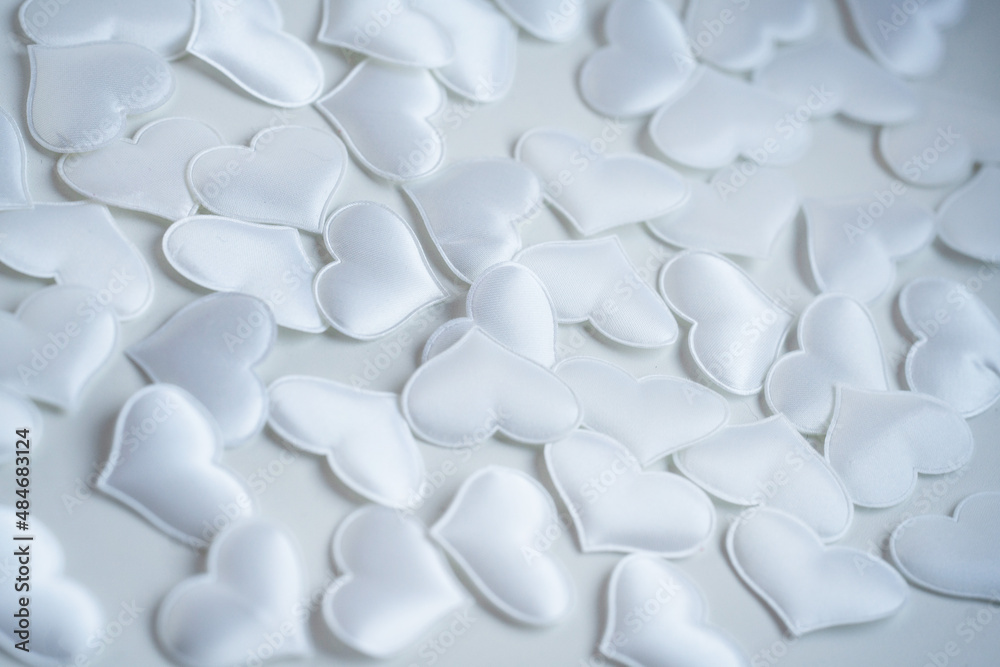 Obraz premium background image of small white silk hearts for the valenita day