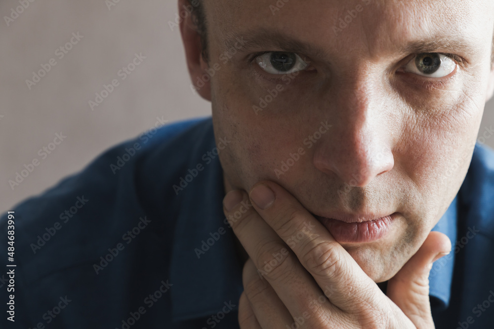 Young serious European man, close up portrait Young serious European man, close up portrait