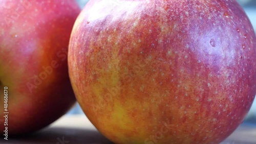 Three red apples close up. Gala is a clonally propagated apple cultivar with a mild and sweet flavour and striped or mottled appearance.
 photo