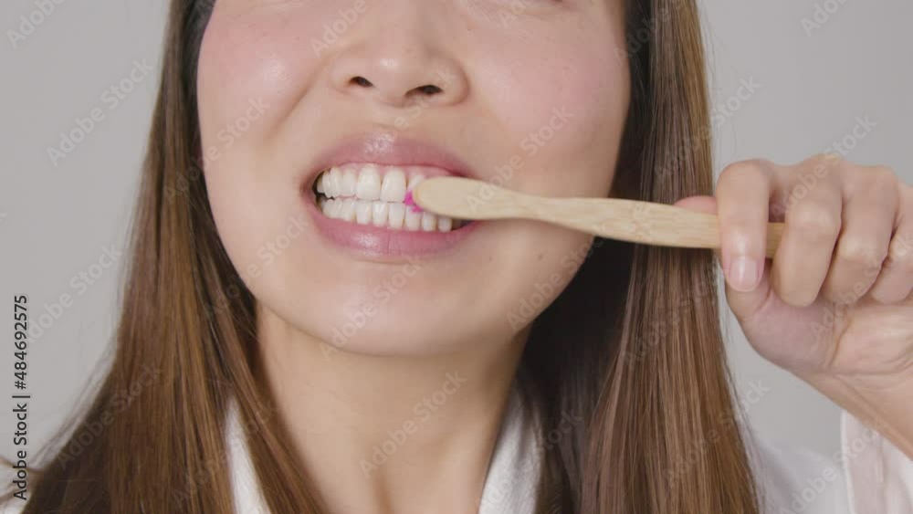 Tracking Shot of Young Woman Brushing Teeth Tracking Shot of Young Woman Brushing Teeth
