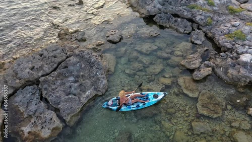 Man paddling a kayak in the sea