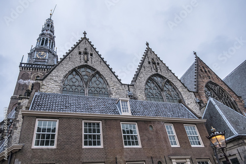 Amsterdam Old Church (Oude Kerk) - oldest building and oldest parish church, founded in 1213. Oude Kerk stands in De Wallen, now Amsterdam's main red-light district. Amsterdam, The Netherlands.